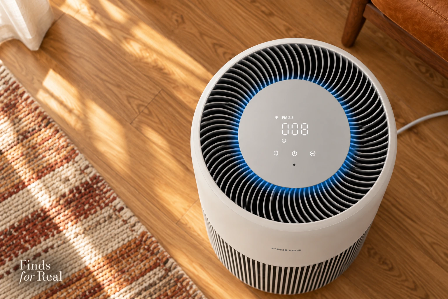 The circular touch panel and radial outlet of the Philips AC2220/10.